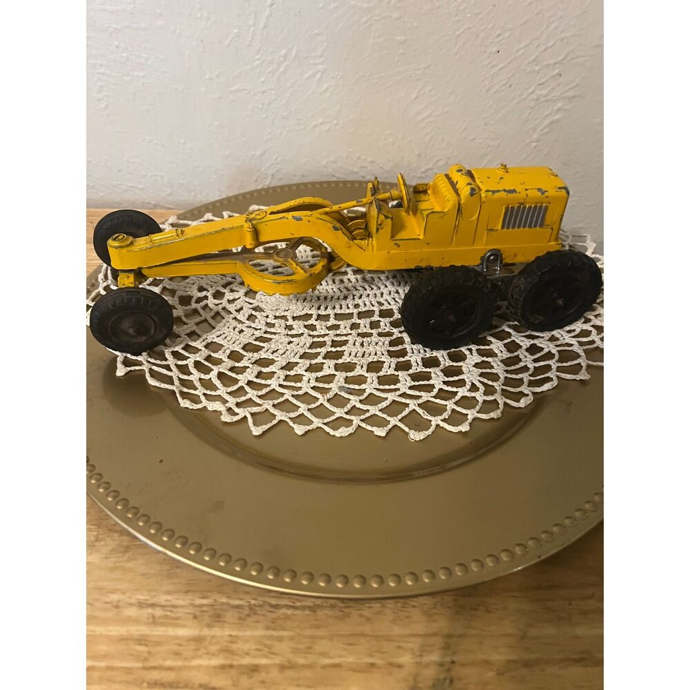 1950s yellow road grader die-cast metal toy from the Hubley Kiddie Toy series.